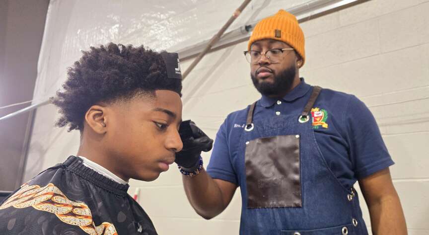 Barbers give advice, trims to students