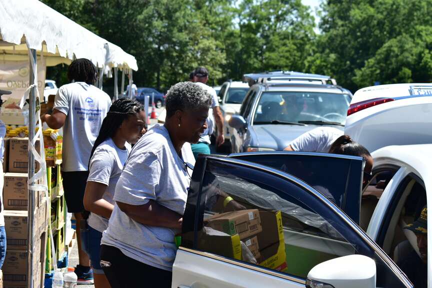 Churches join for drive-thru giveaway