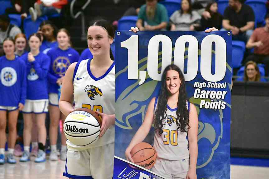 Reid scores 1,000th point; Lady Jackets hang on for U.S. 270 win