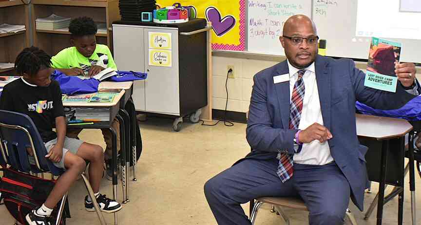 Elementary students in Watson Chapel School District get bags of books